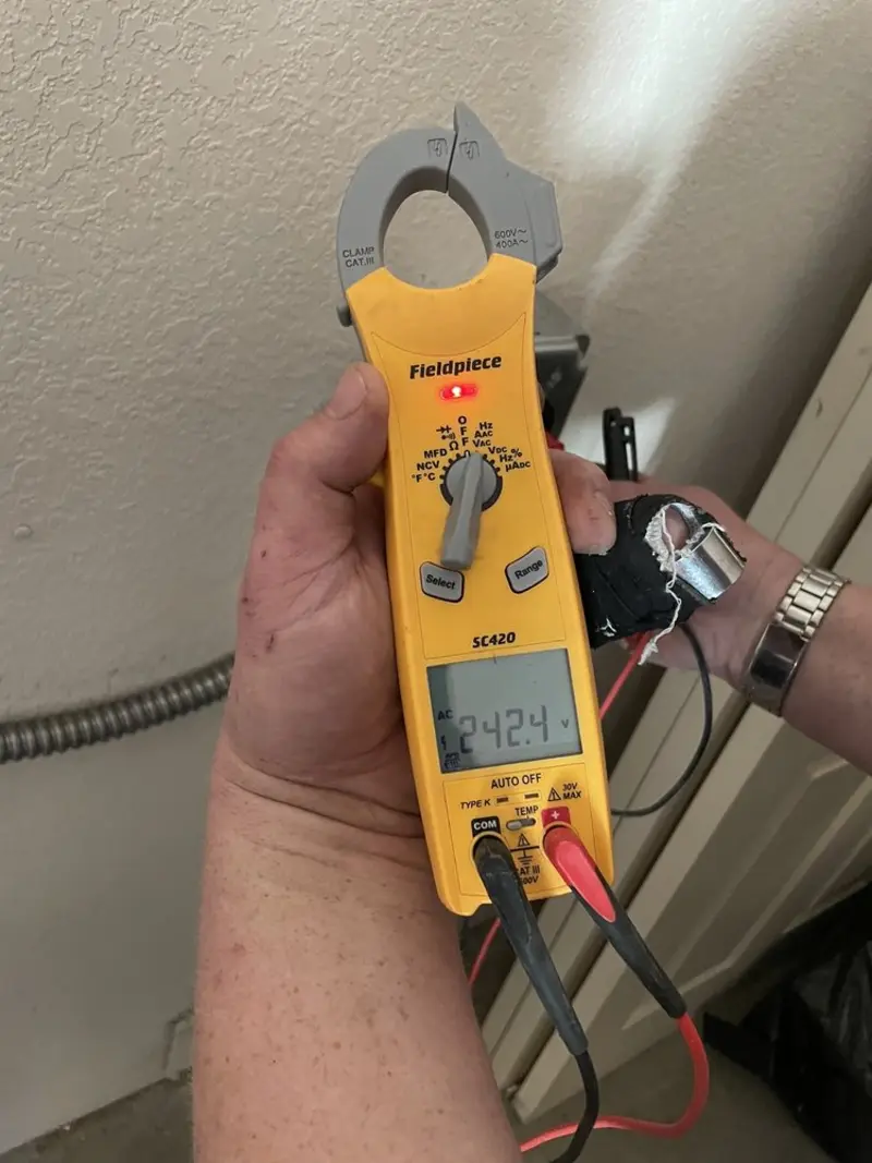 Voltage testing with clamp meter during Generator Installation in Beach Park